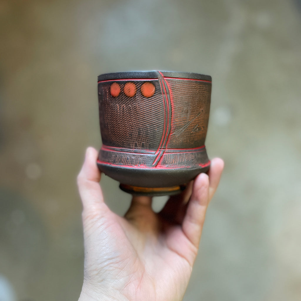 textured hand-built pottery cup